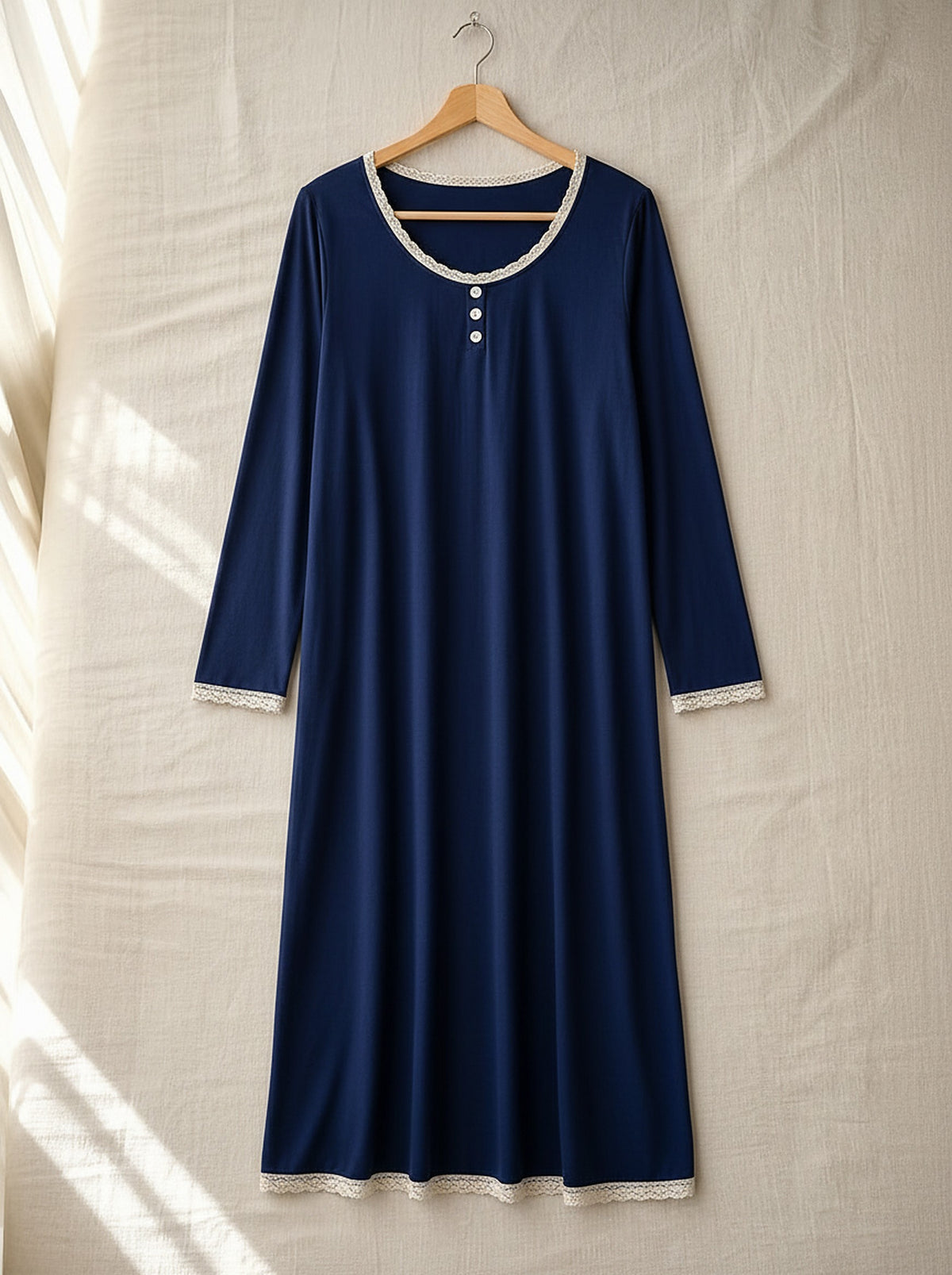 Araminta soft long sleeve nightie, front view on a wooden hanger, Cedar Atelier