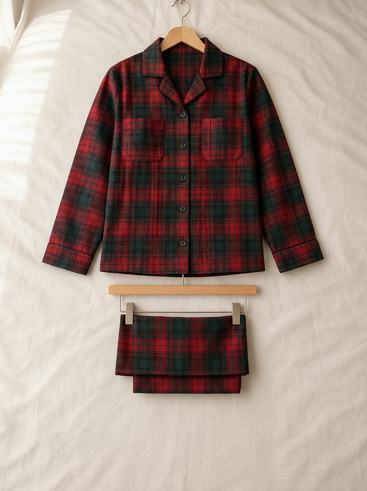 Beatrice soft flannel pyjamas, front view on a wooden hanger, Cedar Atelier
