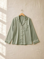 Henrietta satin pyjamas, front view on a wooden hanger, Cedar Atelier