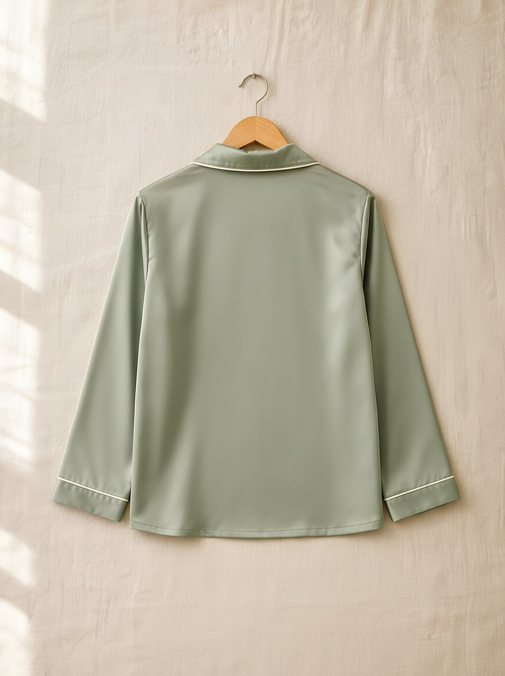 Henrietta satin pyjamas, back view on a wooden hanger, Cedar Atelier