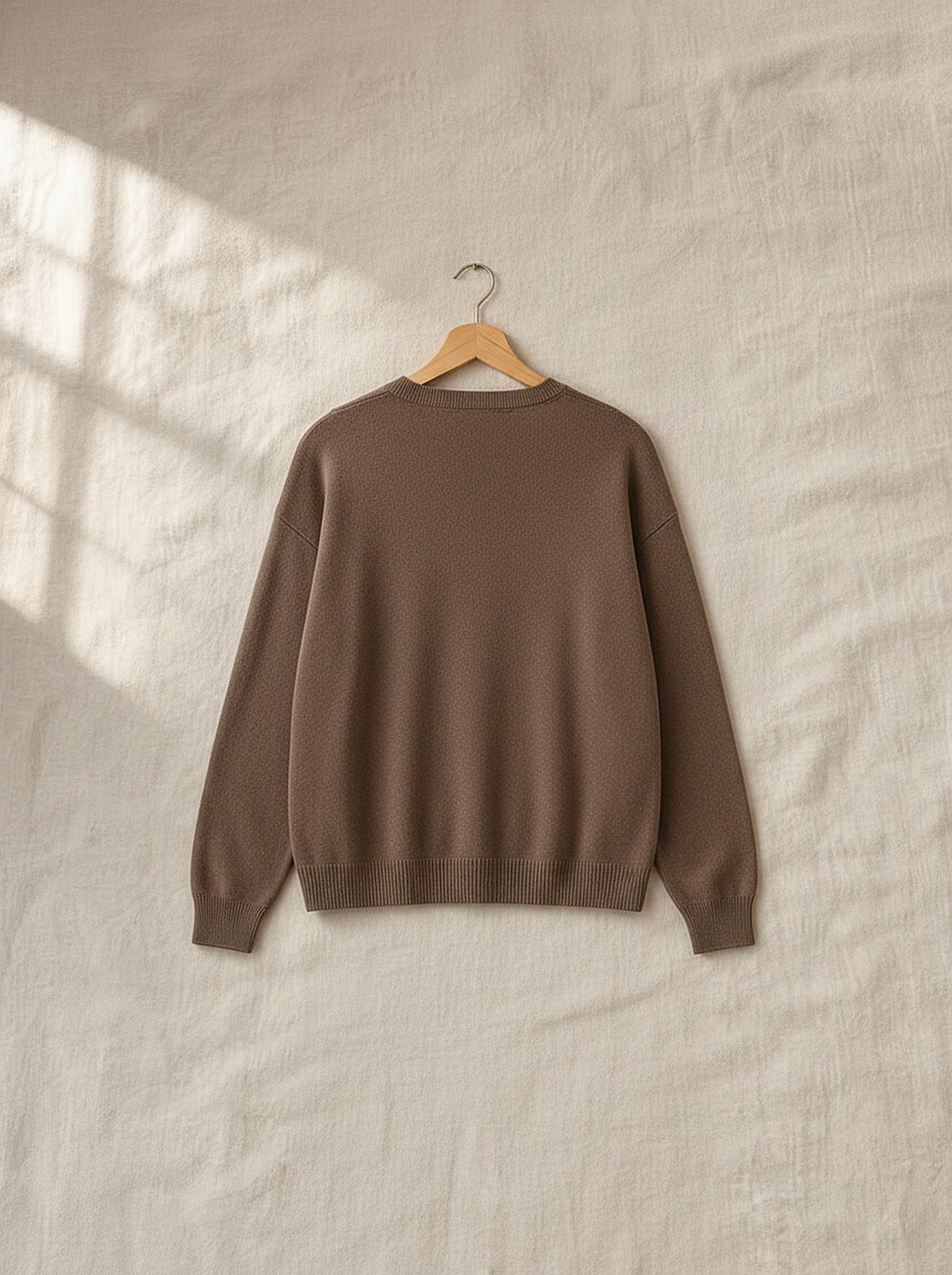 Margot soft knit lounge set, back view on a wooden hanger, Cedar Atelier